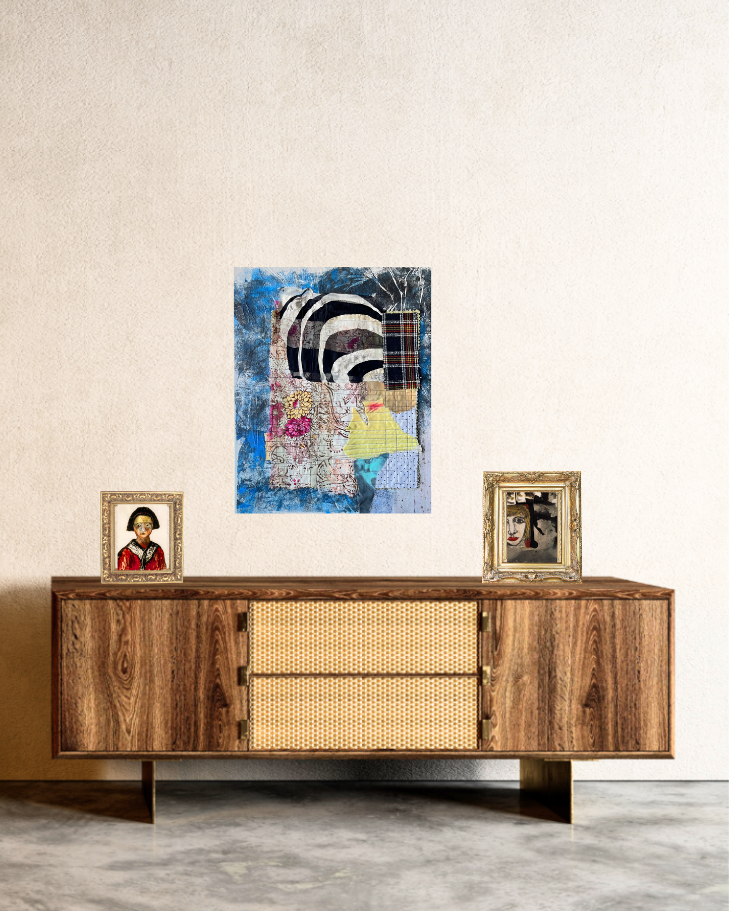 Wooden sideboard with decorative items and a colorful abstract painting on a wall.