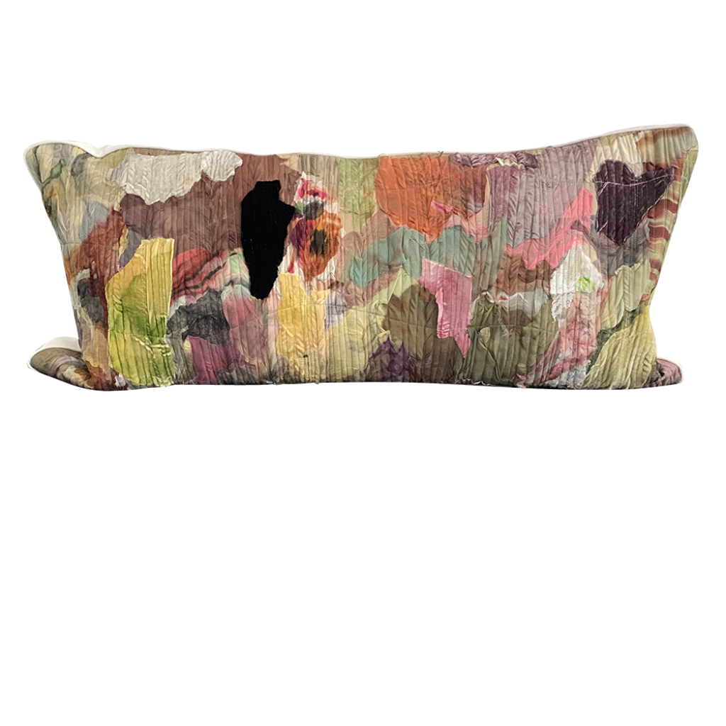 Decorative pillow with a multicolored floral pattern on a white background