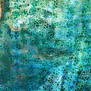 Close-up of textured green and blue surface with bubbles
