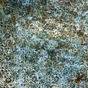 Textured fabric with a floral pattern in green and brown