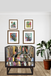 Decorative armchair with patchwork design in a room with framed artwork and a plant.