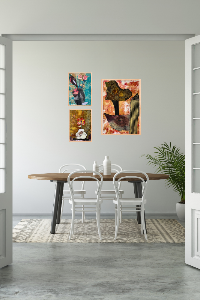 Dining room with a table and chairs, and abstract paintings on the wall.