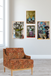 Patterned armchair in a room with abstract paintings on the wall