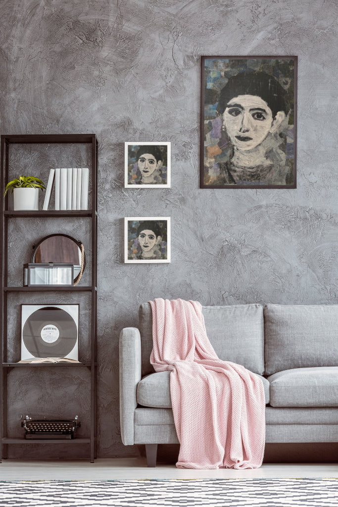 Handmade collage portrait of a woman with expressive eyes and a calm presence, created with textured hand-painted papers in deep blues and neutrals.