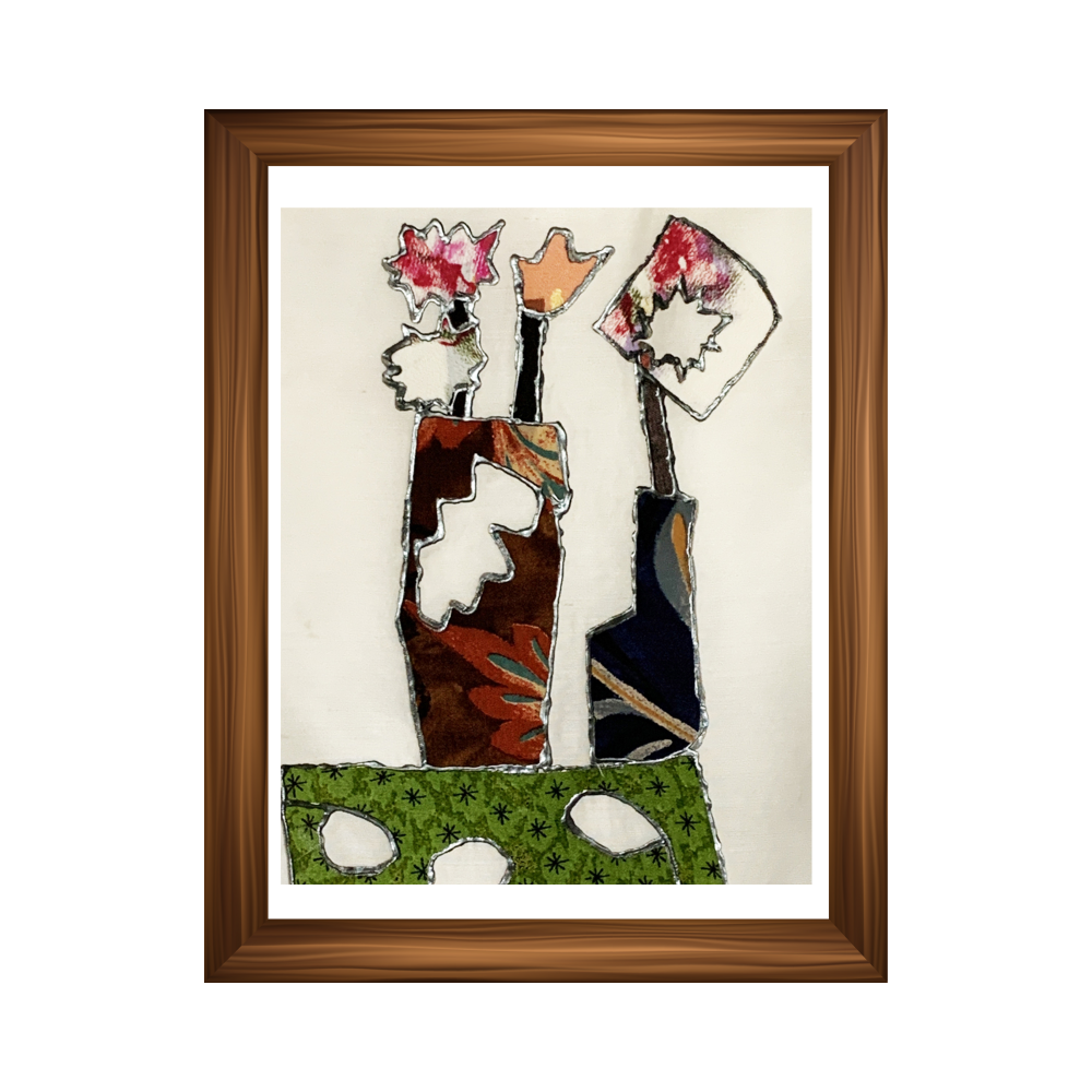 Framed abstract artwork with colorful figures on a beige background