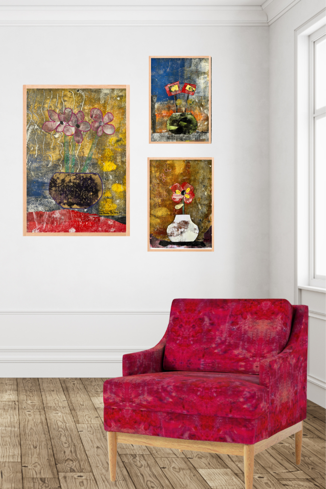 Red armchair in a room with abstract floral paintings on the wall.