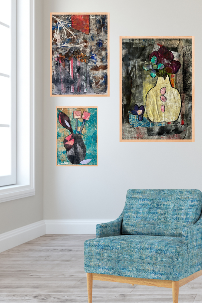 Three abstract artworks on a wall above a blue chair.