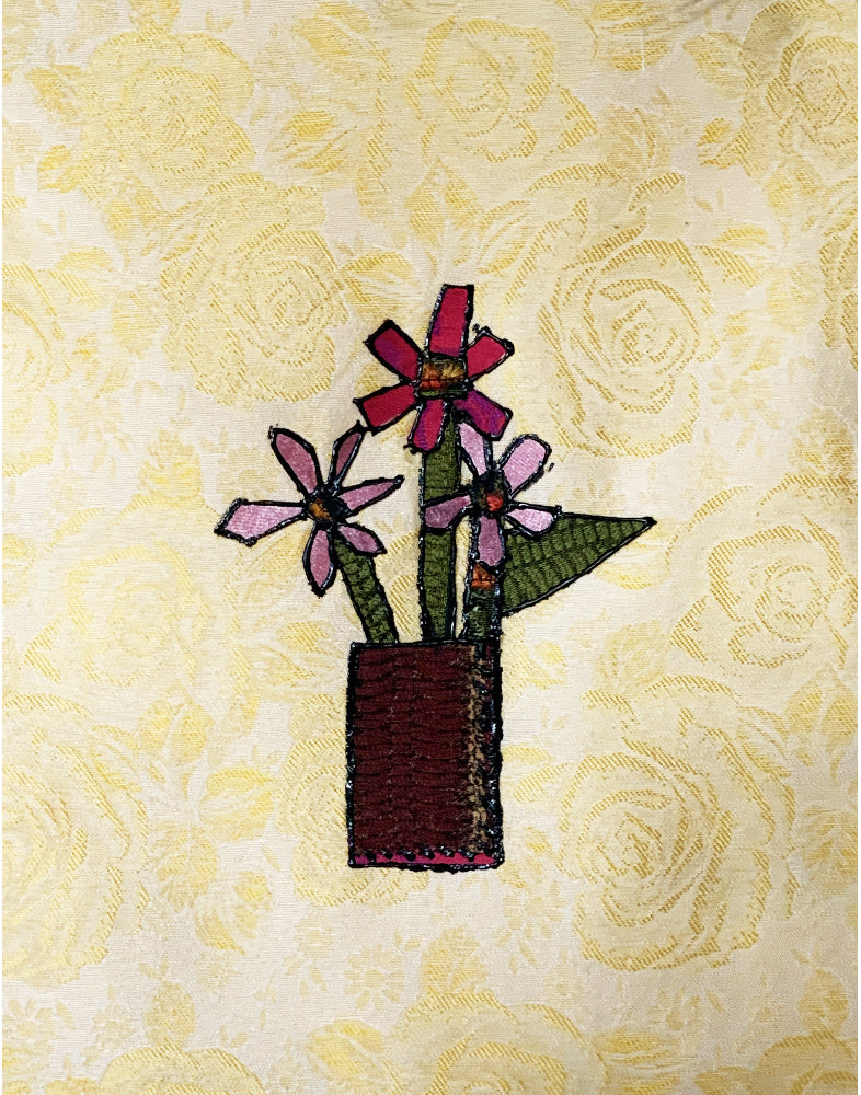 Embroidered design of flowers in a vase on a floral background