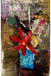 Collage art with a red flower and textured background
