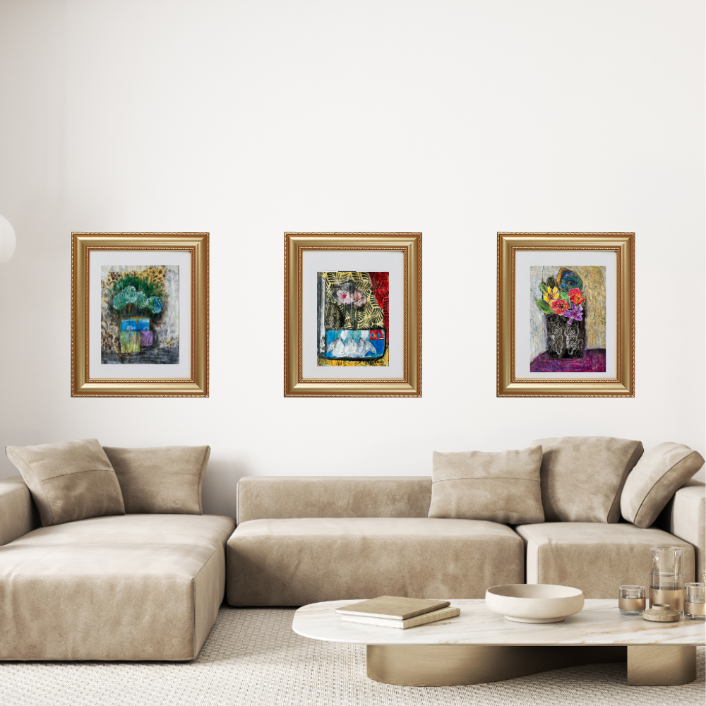 Beige sectional sofa with three framed artworks on a white wall.