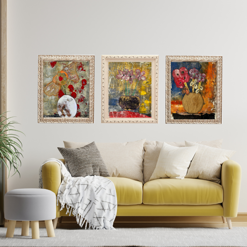 Wall Art. Yellow sofa with decorative pillows and a white ottoman in a living room with floral artwork on the wall.