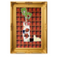 Decorative wall art with a plaid pattern and cartoonish cow design in a gold frame.