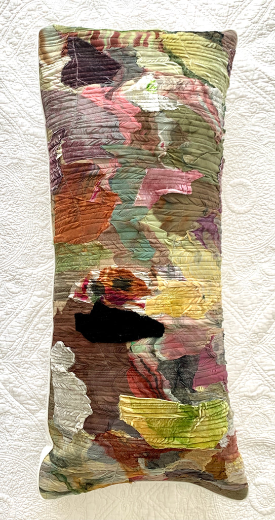 Colorful textured rectangular pillow on a white background