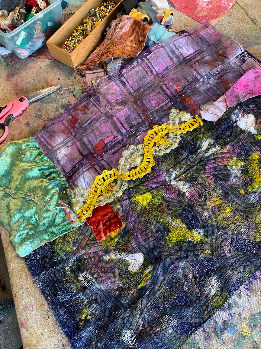 Detail: Original textile-on-paper mixed-media artwork featuring dark abstract textures, stitched yellow textile ribbon, green quilted fabric, layered collage, and acrylic paint.