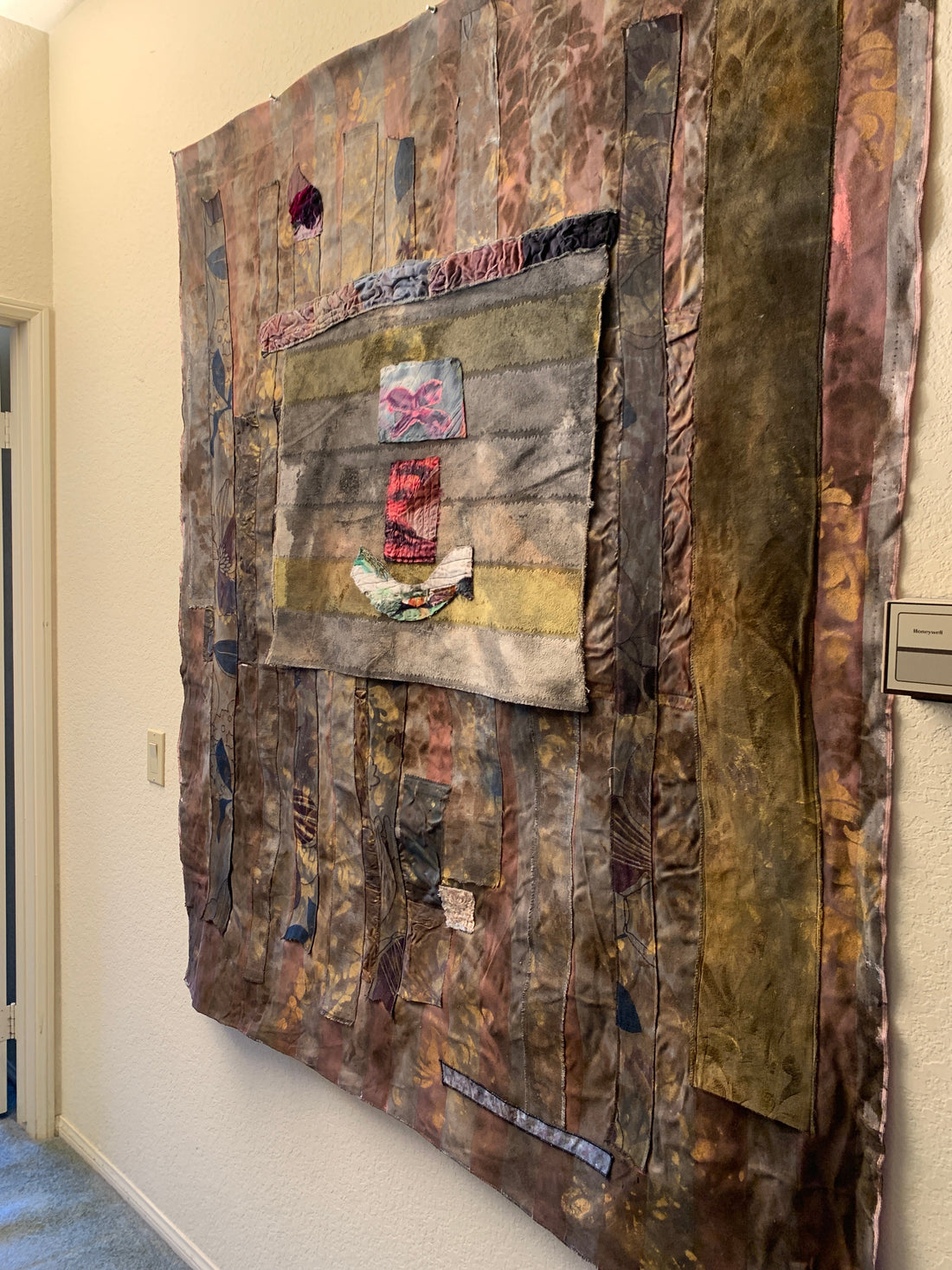 Modern art tapestry wall hanging with fiber art texture and layered design, displayed as contemporary wall decor in a stylish home interior.