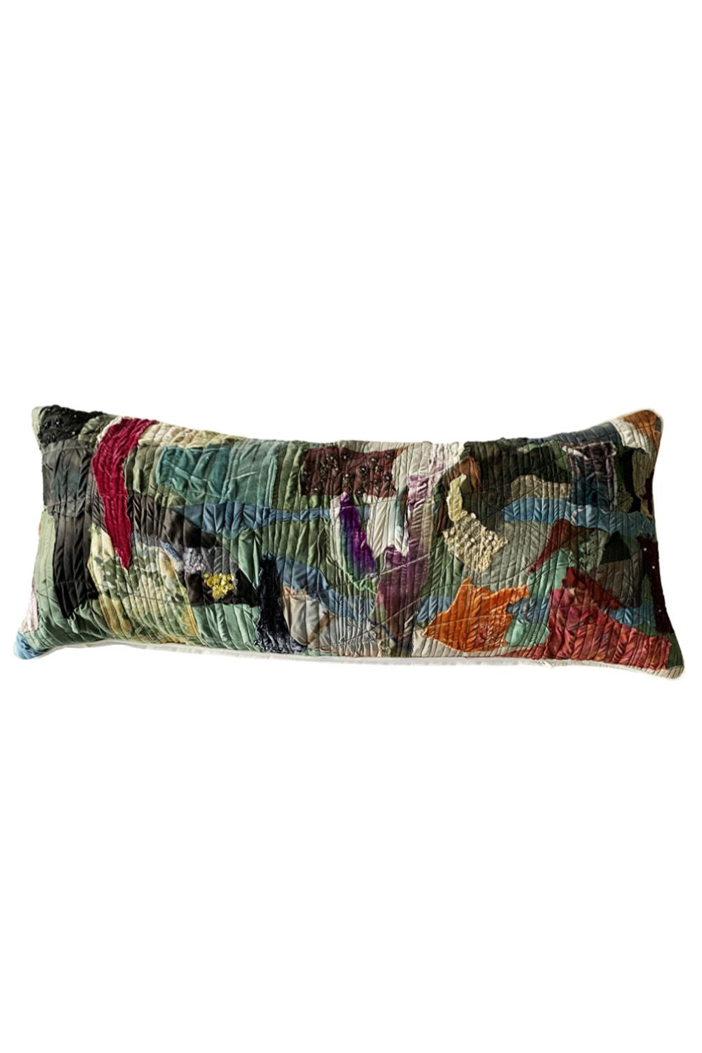 A rectangular lumbar throw pillow featuring a highly textured, multicolored abstract patchwork design with green, red, orange, purple, and black threads, shown against a plain white background.