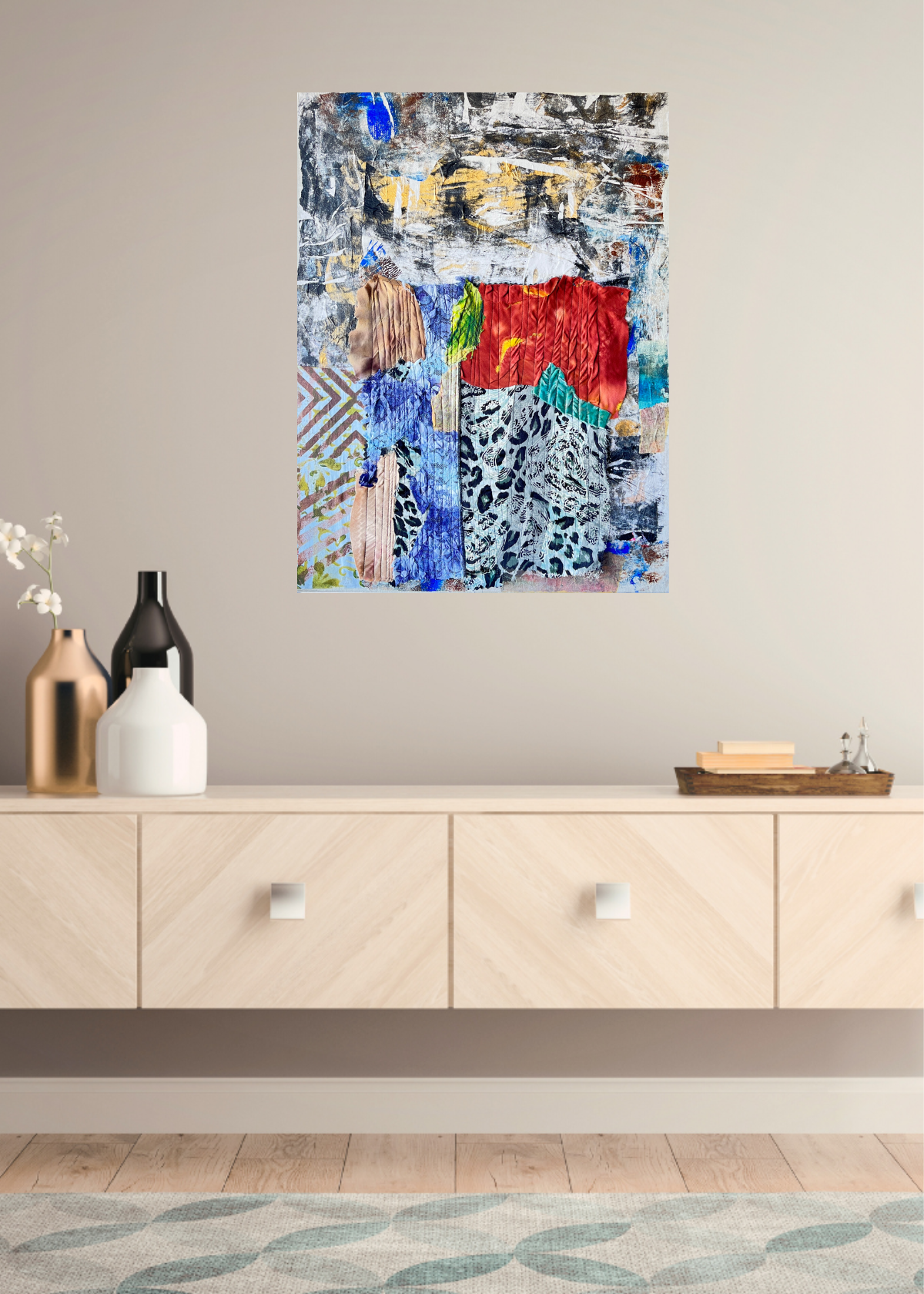 Abstract painting on a wall above a wooden cabinet with decorative items.