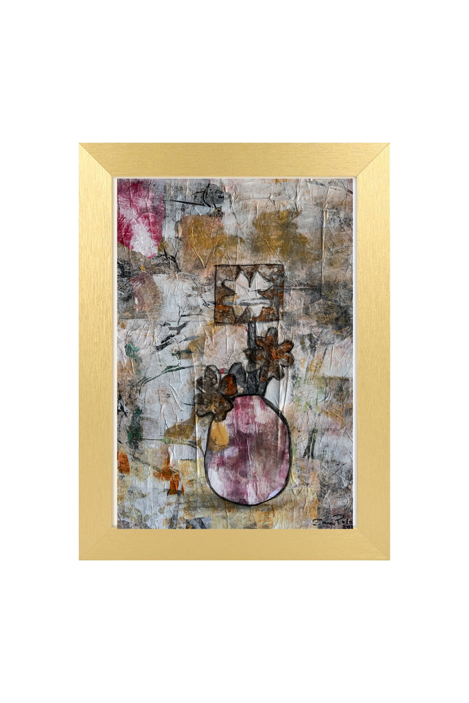 Abstract art piece in a gold frame on a white background