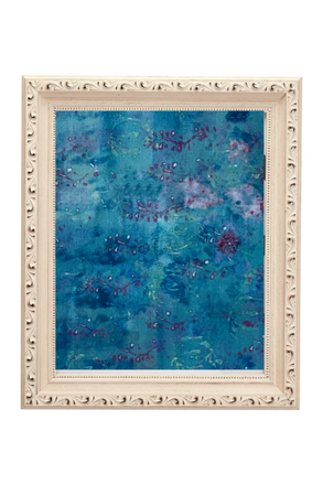 Framed abstract artwork with blue and purple hues on a white background