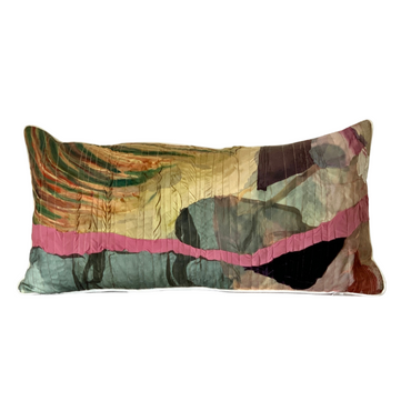 Multicolored patterned pillow on a white background