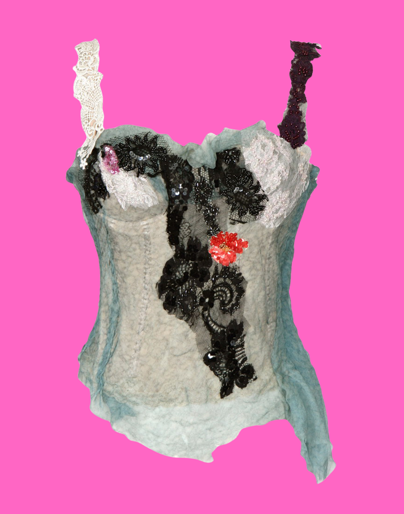 Decorative top with black sequin design and floral details on a pink background