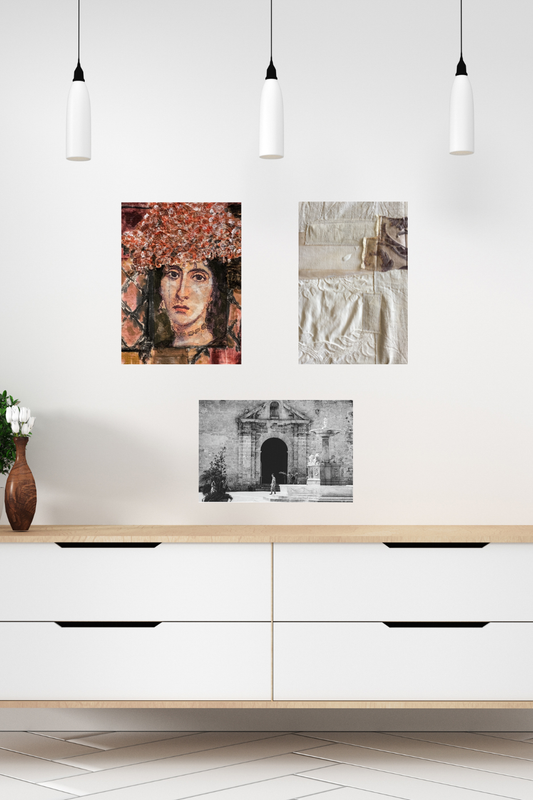 Modern interior with white wall, wooden cabinet, and framed artworks.