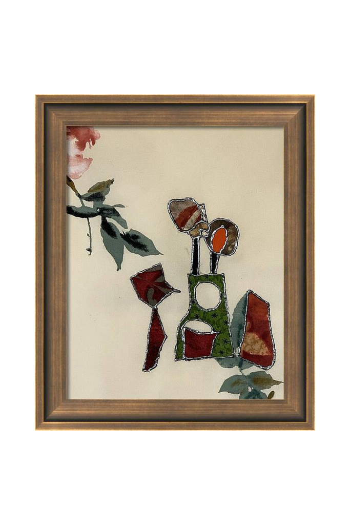 Framed abstract artwork with colorful elements on a beige background