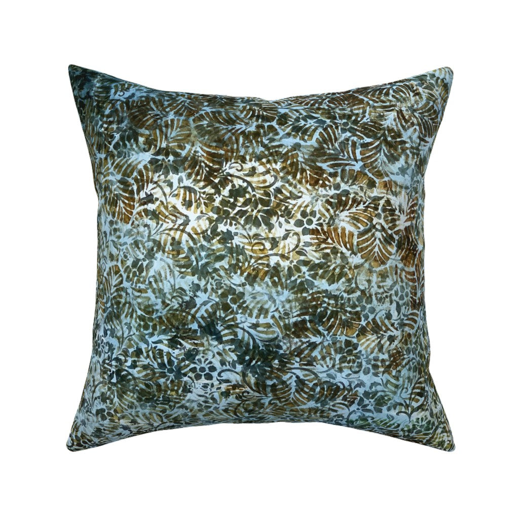 A square throw pillow featuring an abstract botanical pattern in shades of teal, olive green, brown, and cream on a white background.