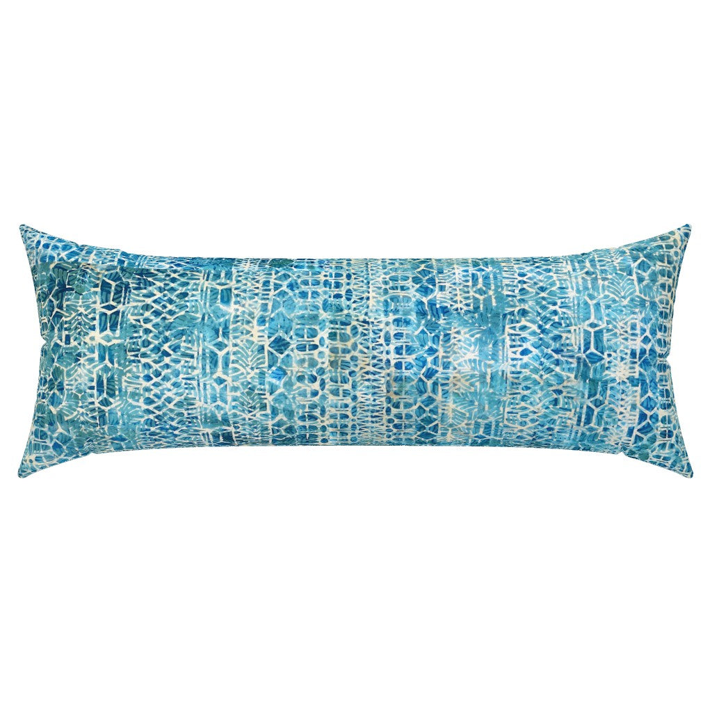 Blue patterned pillow on a white background