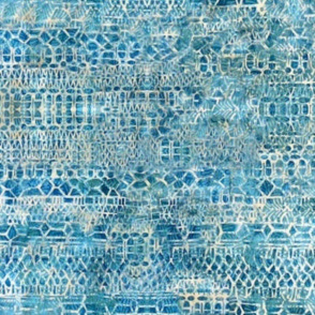 A close-up of a blue and white patterned fabric or wallpaper featuring a textured, distressed geometric design.