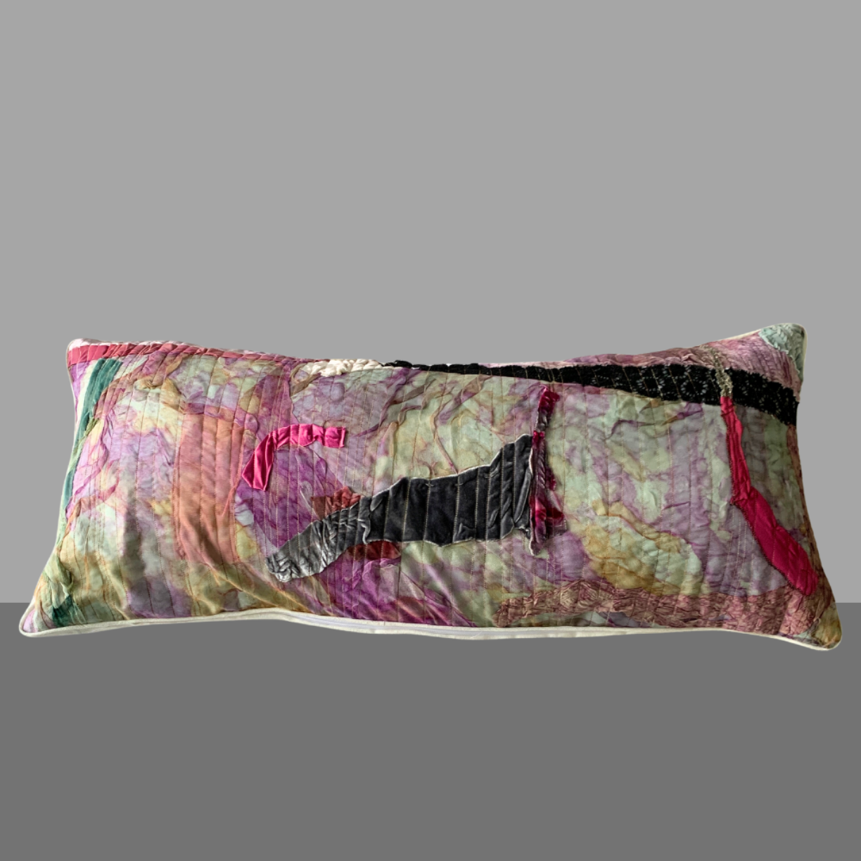 Decorative pillow with a colorful pattern on a gray background