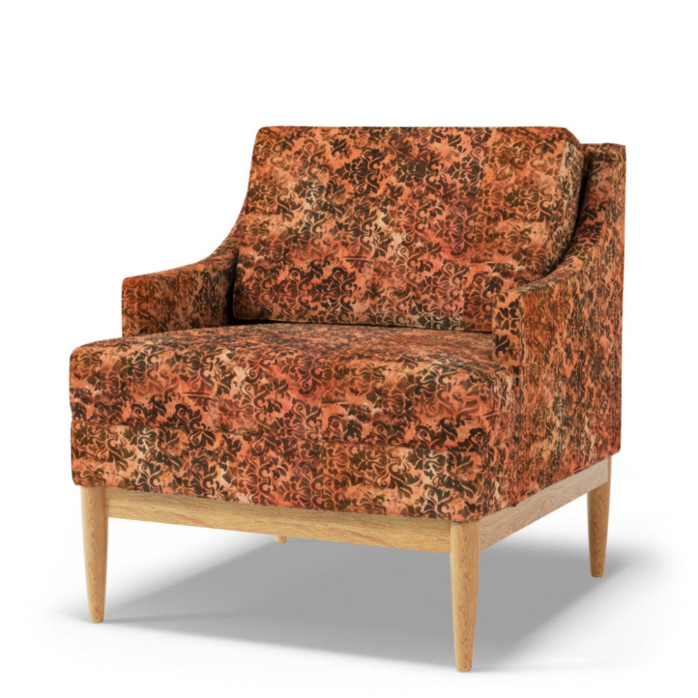 Orange-patterned armchair with wooden legs on a white background