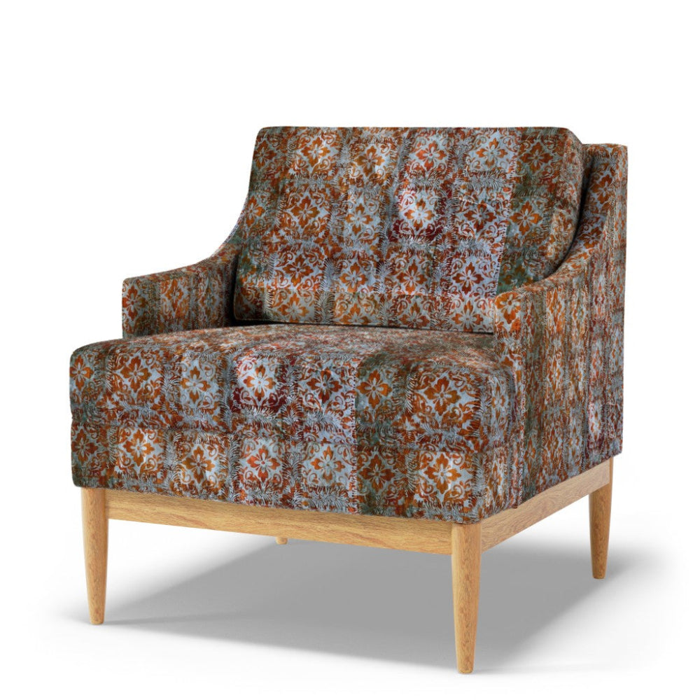 Patterned armchair with wooden legs on a white background