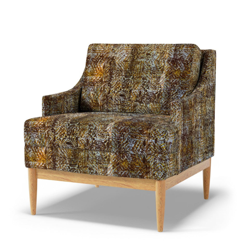Patterned armchair with wooden legs on a white background