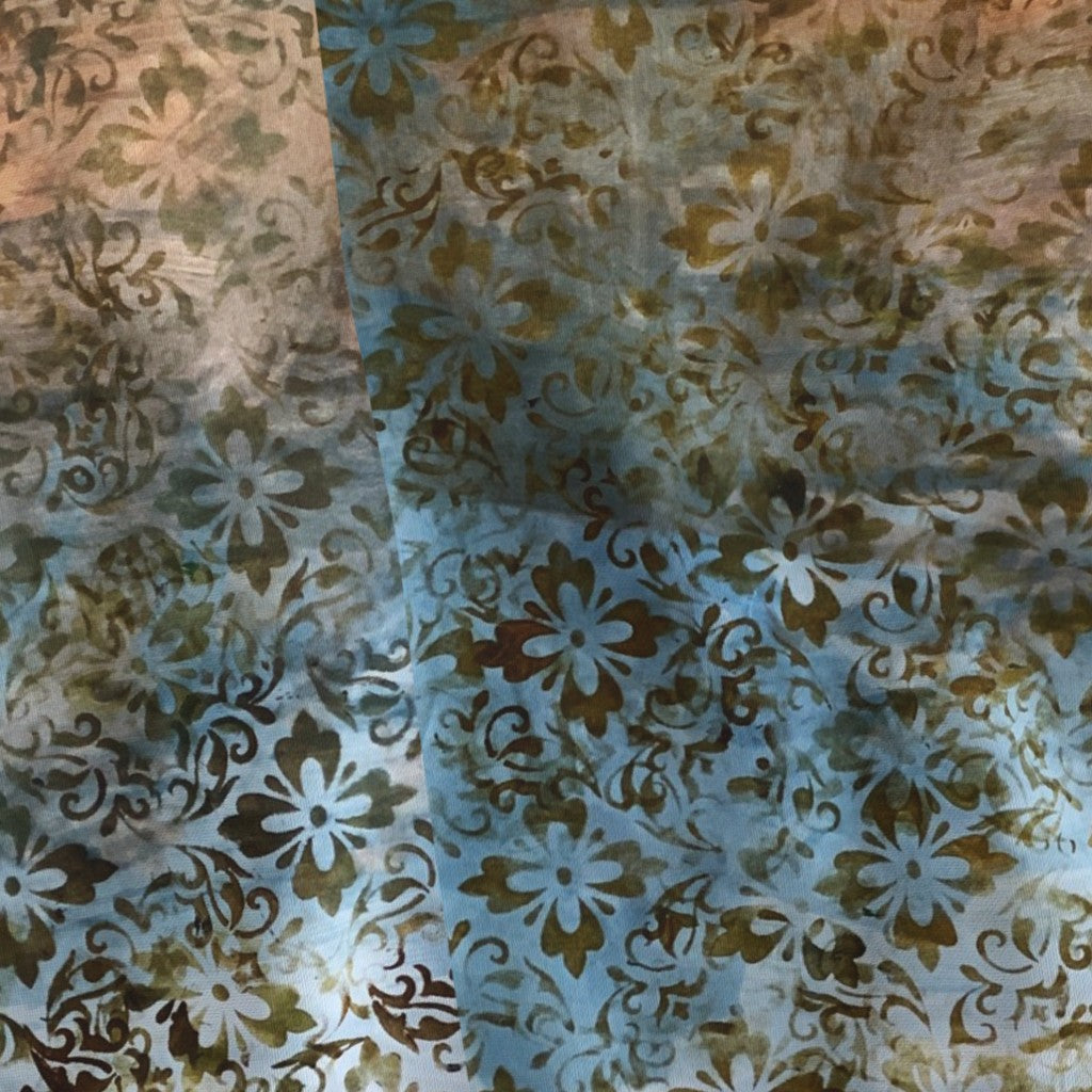 Patterned fabric with floral design in brown and blue tones