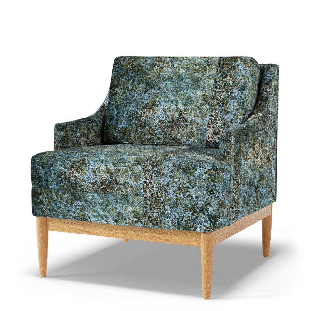 Patterned armchair with wooden legs on a white background