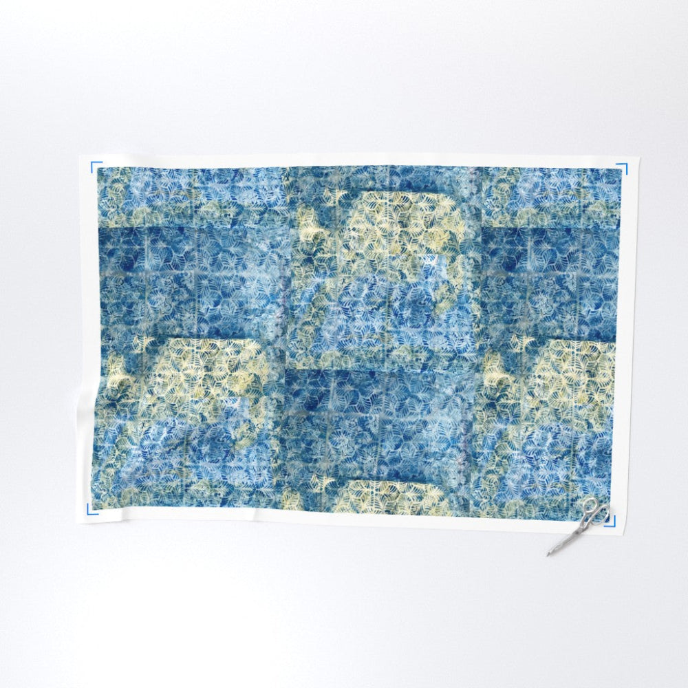 Blue and green patterned paper on a white background
