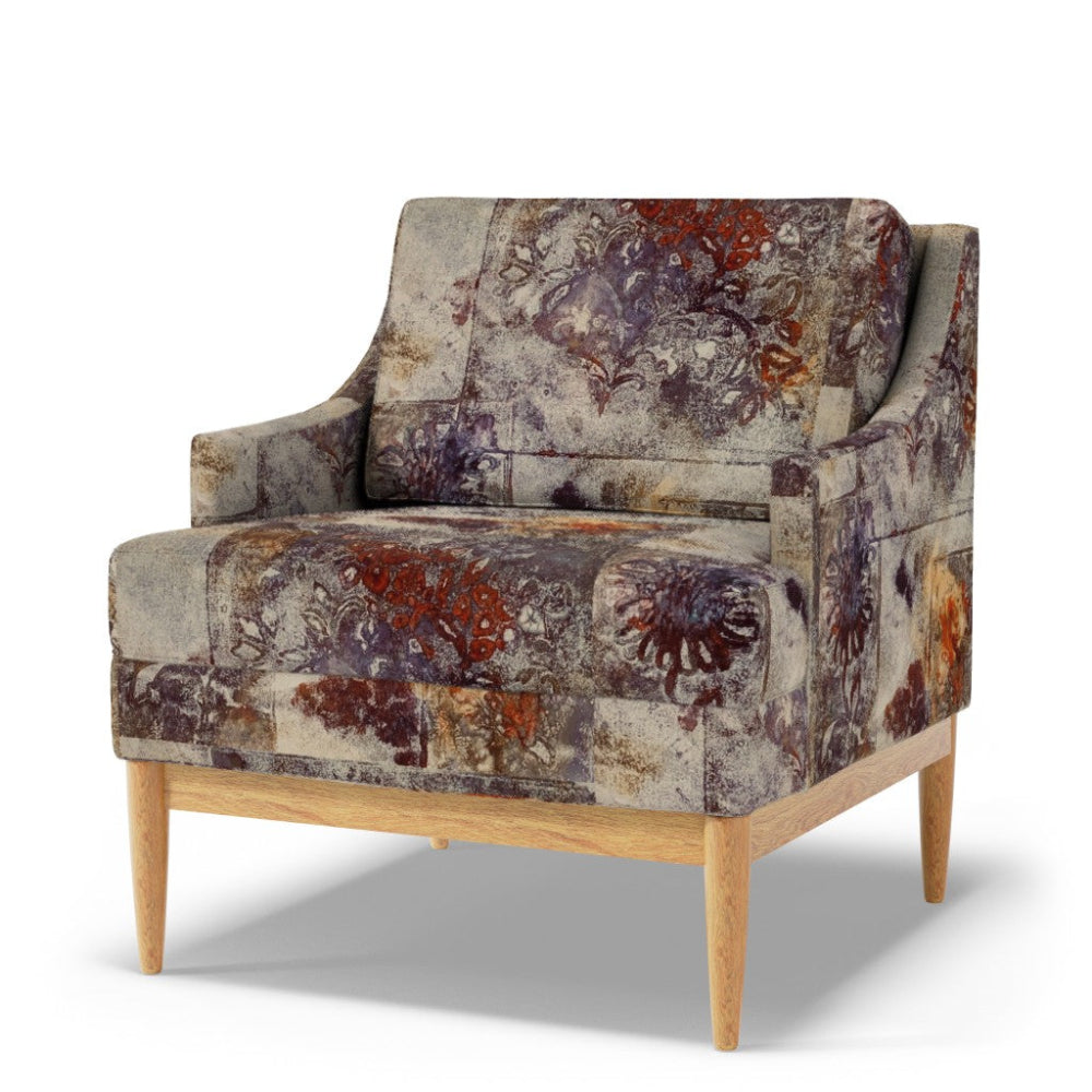 Patterned armchair with wooden legs on a white background