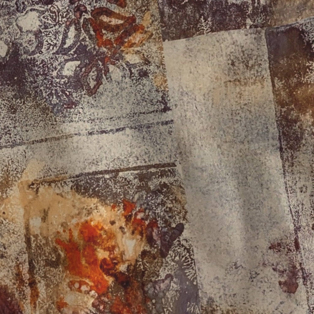 Textured fabric with a patchwork pattern in earthy tones