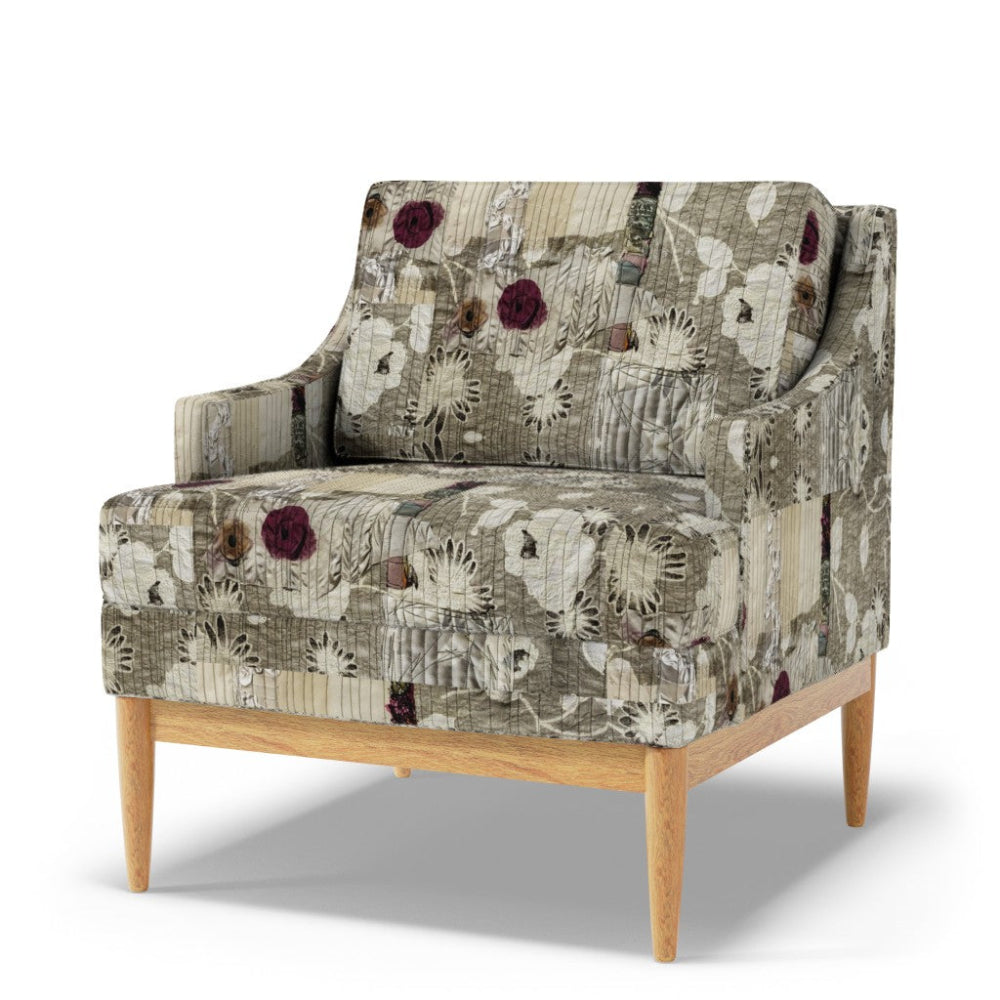 Patterned armchair with wooden legs on a white background