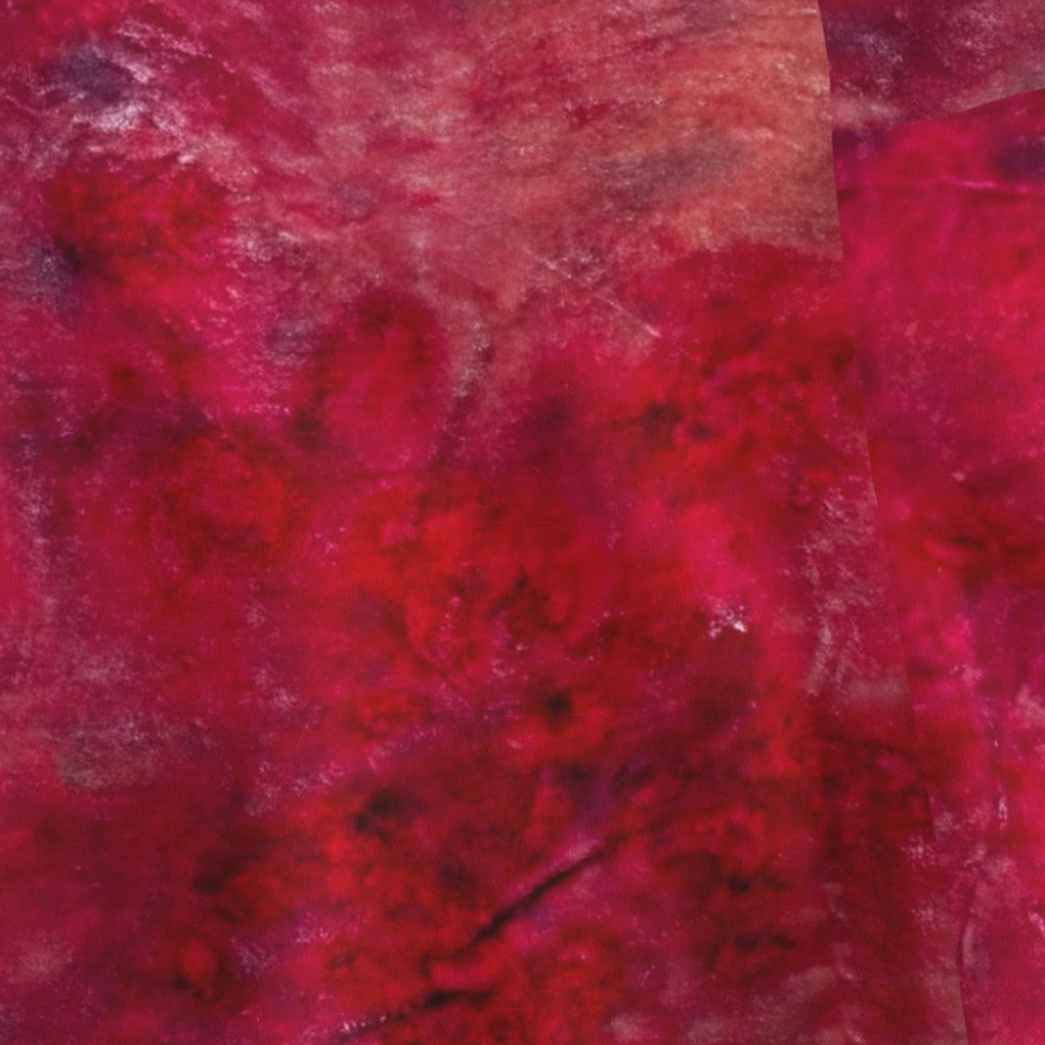 Close-up of a textured red fabric with a pattern