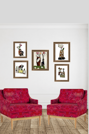 Two red armchairs in a room with framed artwork on the wall.