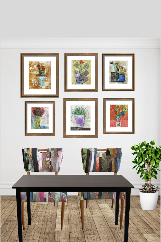 Dining room with a black table and colorful chairs, framed artwork on the wall.