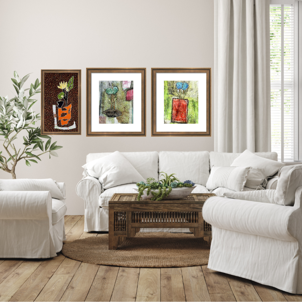 Living room with white sofa, wooden coffee table, and framed artwork on the wall.