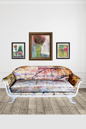 Decorative sofa with floral pattern in a room with framed artwork on the wall.