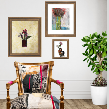 art wall with 3 painting, unique upholstered chair and a plant