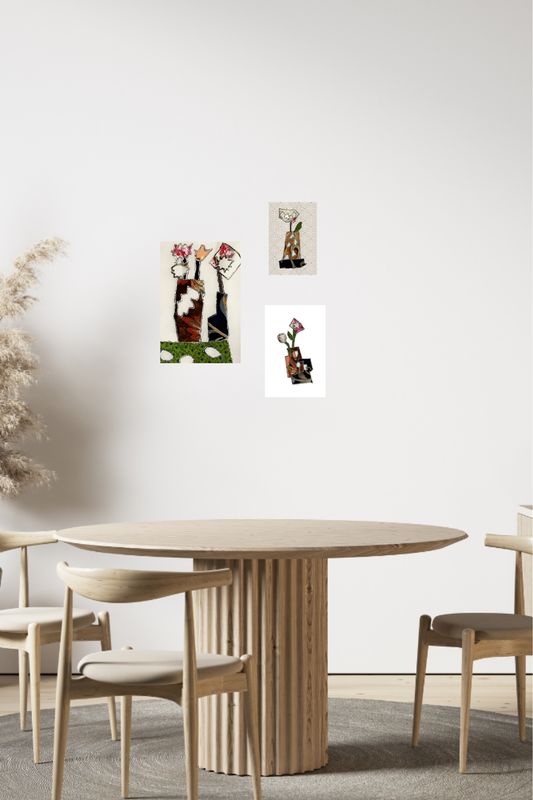 Dining room with a round wooden table and chairs, featuring wall art on a white wall.