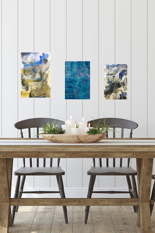 Dining room with wooden table, chairs, and abstract art on a white paneled wall.