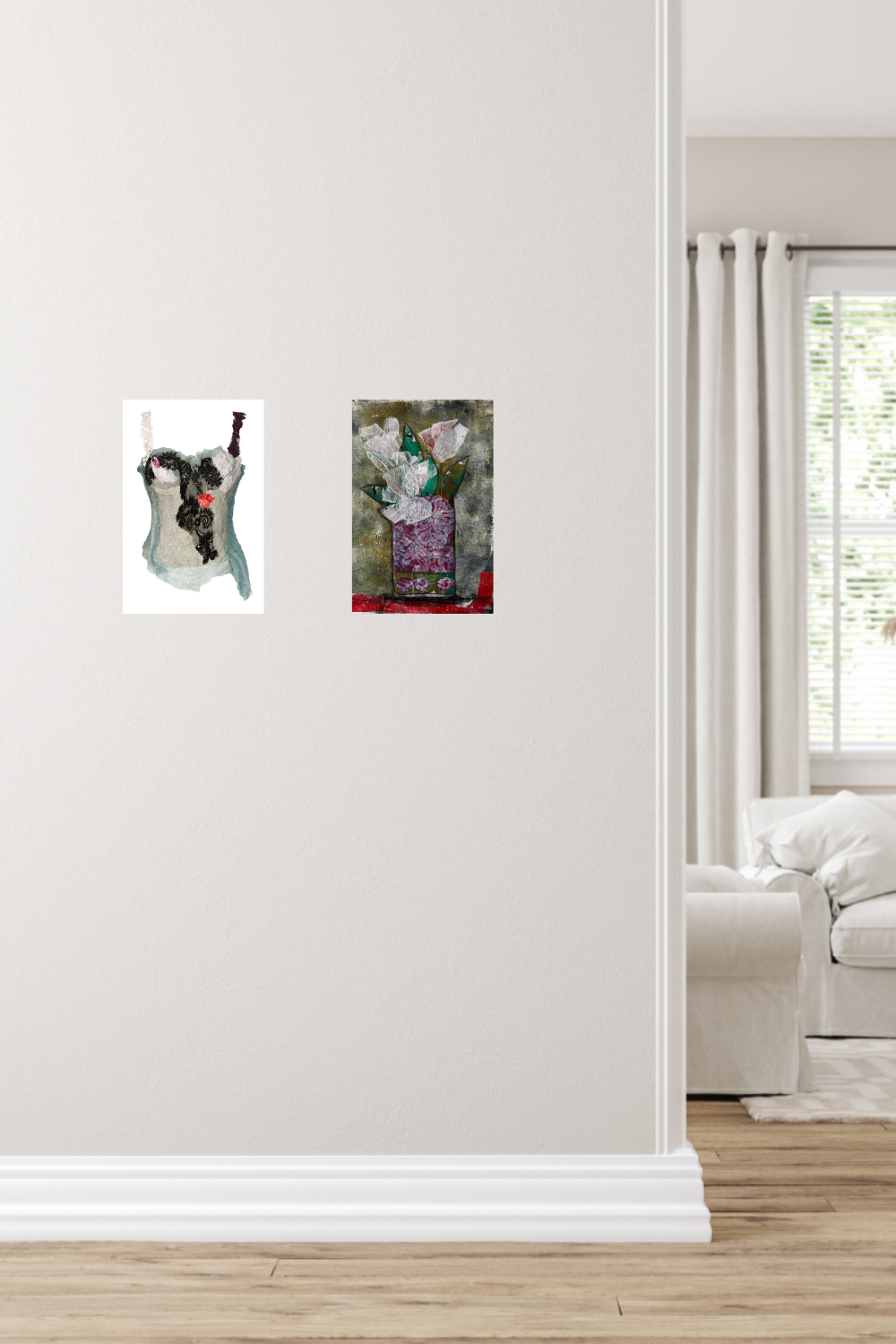 Two small framed artworks on a white wall with a living room in the background.
