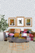 Colorful patchwork sofa with a patterned wall and decorative items.